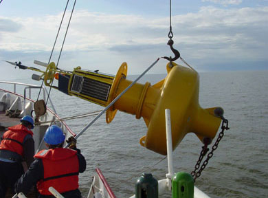 A buoy, equipped with scientific gear, is retrieved from the lake.
